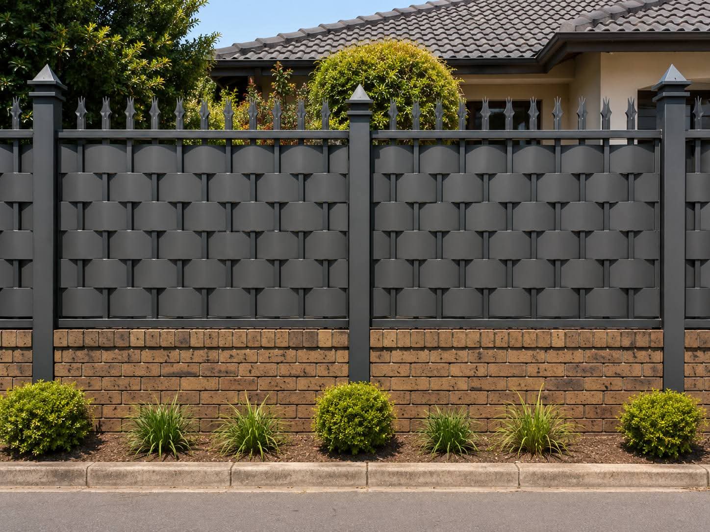 Modern charcoal privacy panels in a garden courtyard